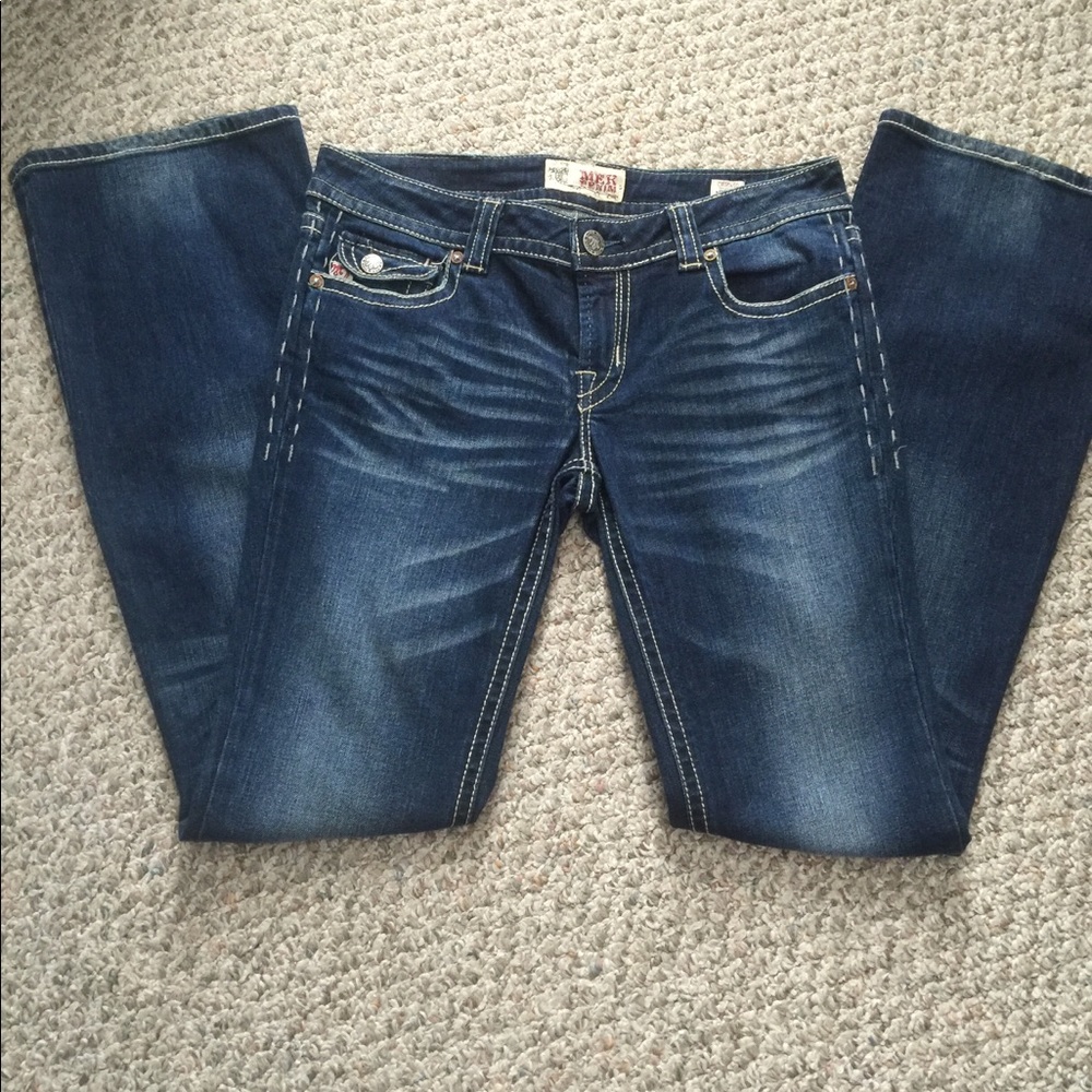 MEK Chicago boot cut slightly distressed jeans.